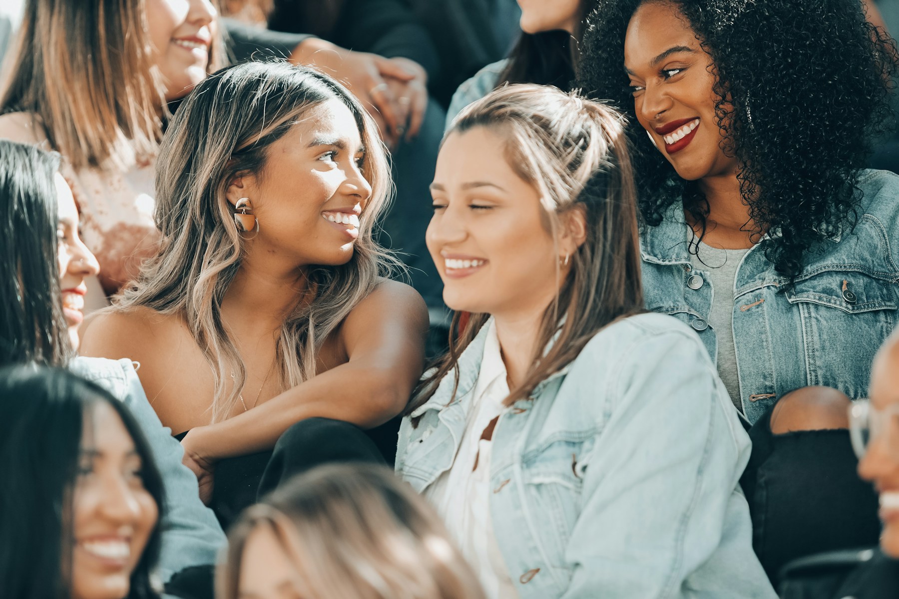 Women seated together in supportive conversation